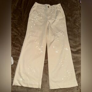 Anthropologie Pilcro Cream and White Trousers with white paint splatter